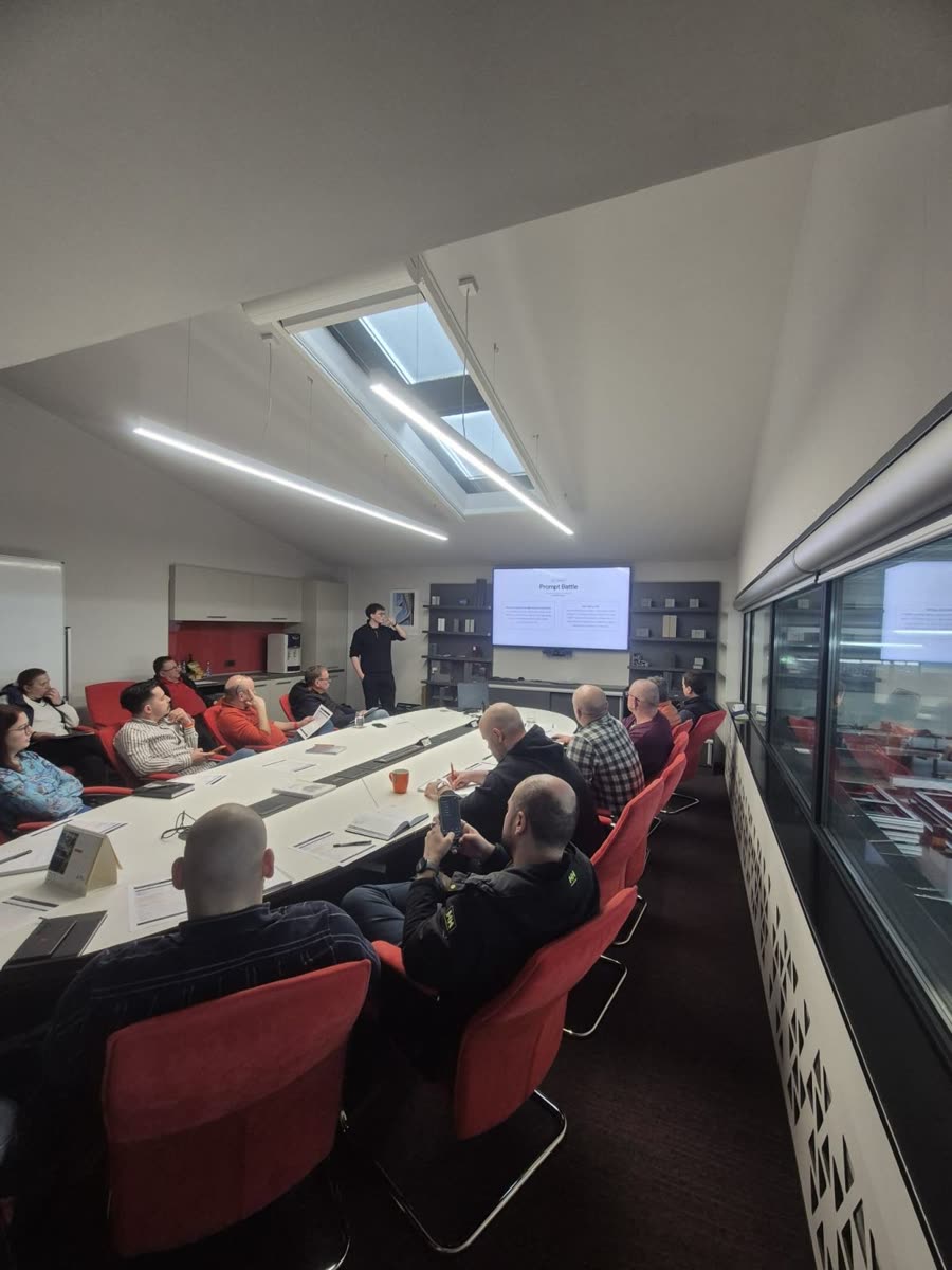 A team working through exercises around the meeting table